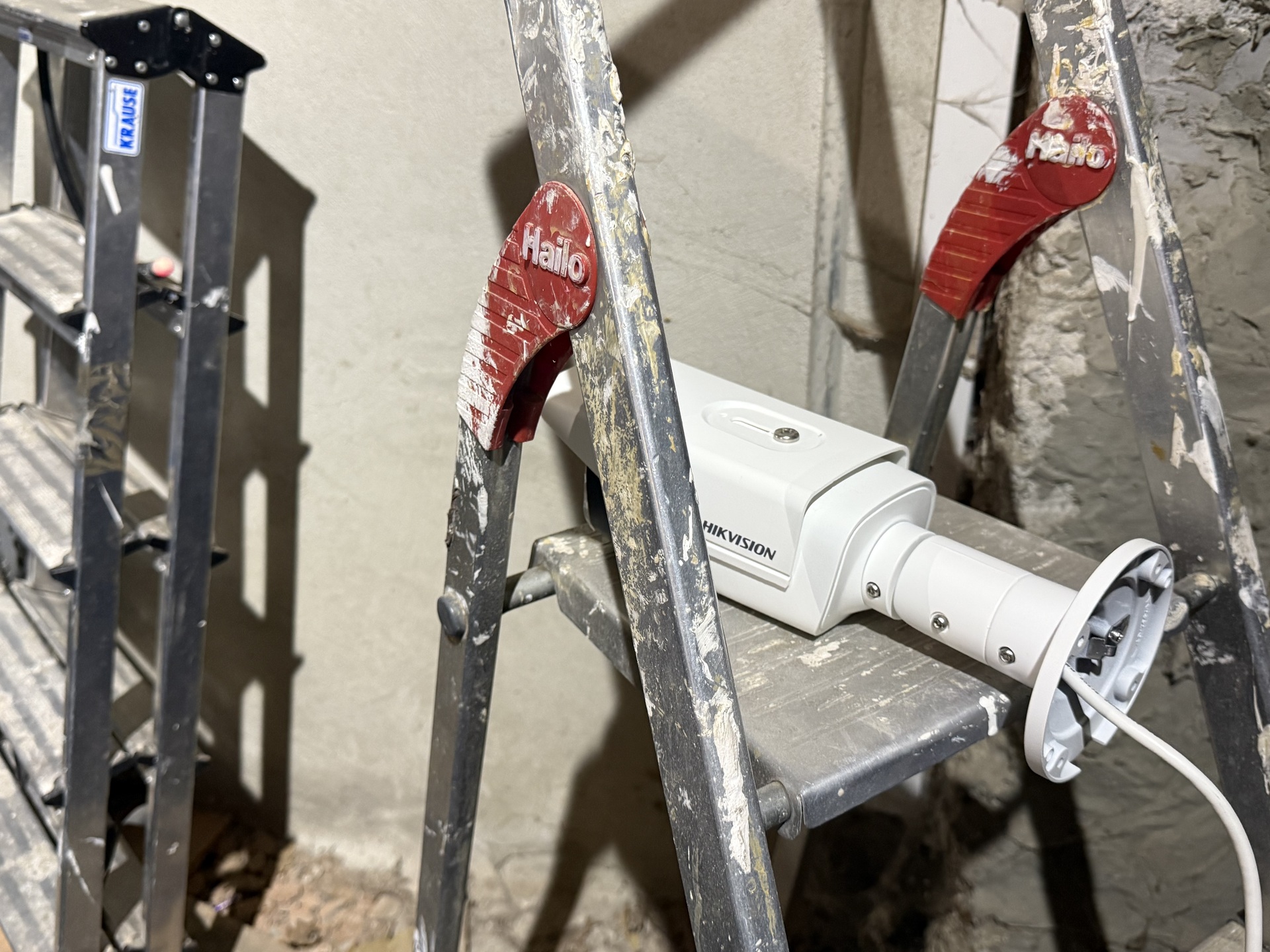 Tip of an unterminated fiber optic cable lit up in red